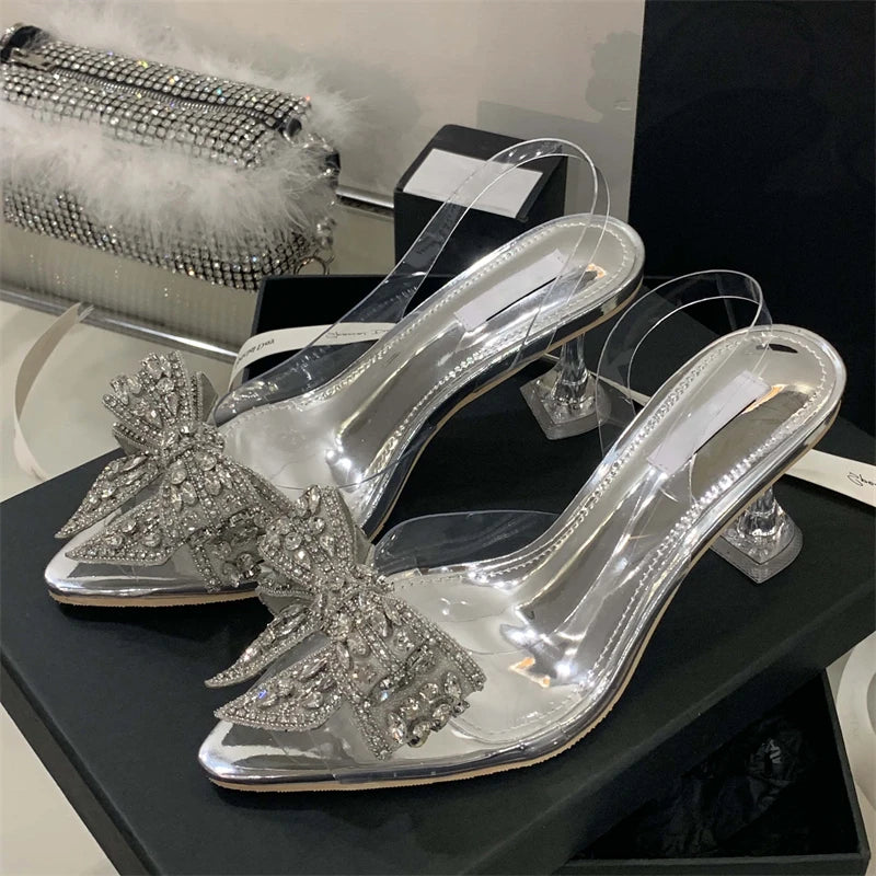 Aneikeh Sexy Pointed Toe Bow Crystal PVC Transparent Women Slingbacks Pumps Elegant Thin High Heels Strippers Prom Mule Shoes